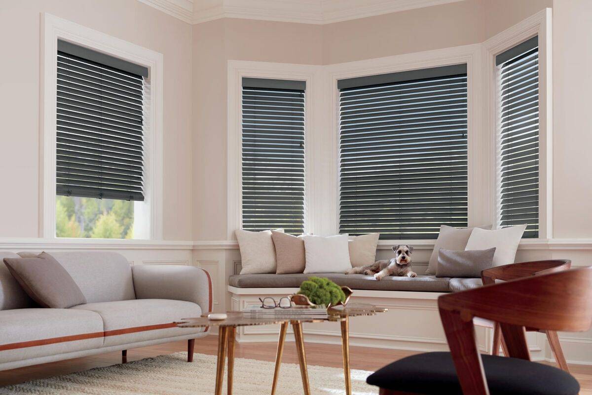 Hunter Douglas Parkland® Wood Blinds decorating windows in a white-themed living room near Virginia Beach, Virginia (VA)
